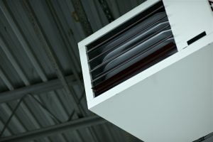 Air conditioning unit attached to factory ceiling