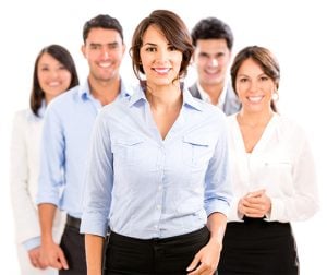 Team photo of professionals from various industries smiling at the camera