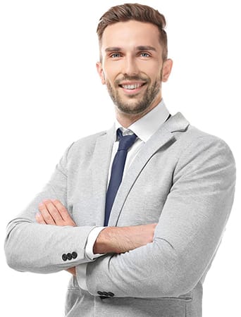 Businessman in a grey suit, arms crossed and smiling into the camera