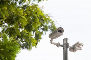 Security equipment attached to a tall pole outside