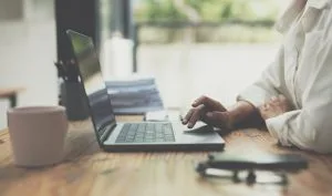 a small business owner conducting research into asset finance