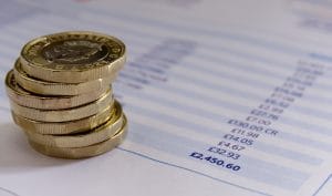 British pound coins on a budget spreadsheet