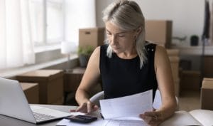 A small business owner conducting her uk business tax calculation