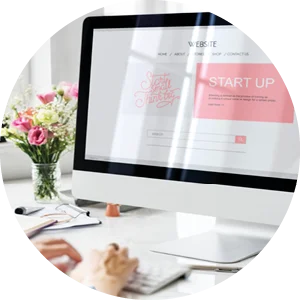Woman using iMac to create her new website for her business