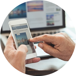website_image_2 man tapping on phone to navigate through website